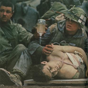 John Olson photo of wounded Marine in Vietnam