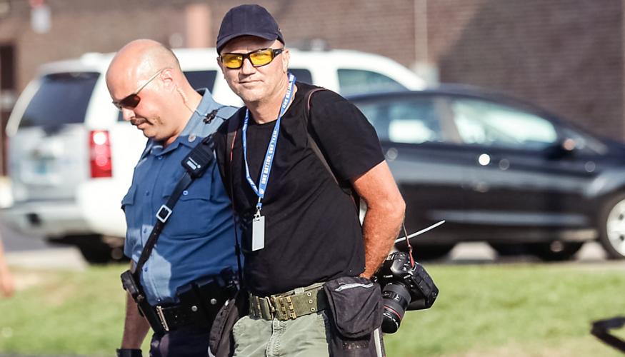 Police arrest Getty Images photographer Scott Olson in Ferguson, Mo., on Aug. 18, 2014.