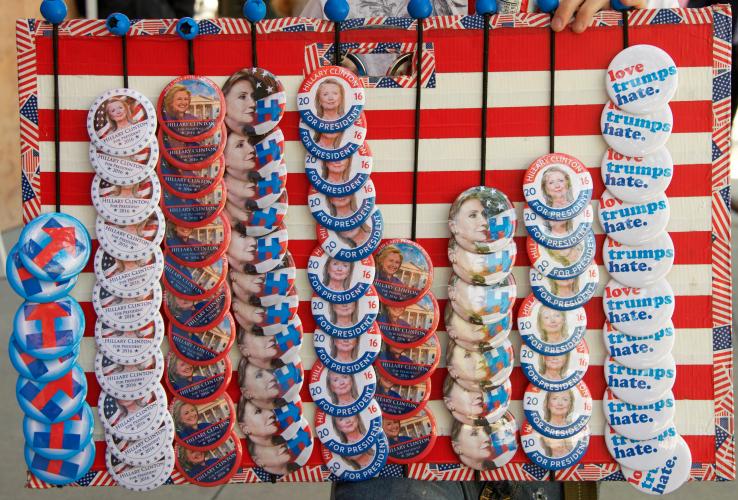 A vendor sells pins to supporters of Democratic contender Hillary Clinton at a May 26, 2016, rally in San Jose, Calif., shortly before that state's primary.